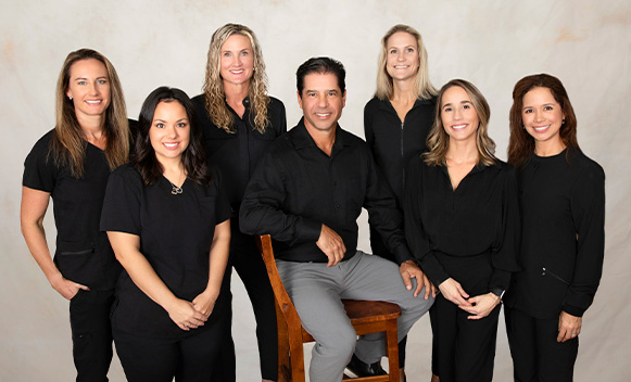 Smiling Daytona Beach dentist and dental team members