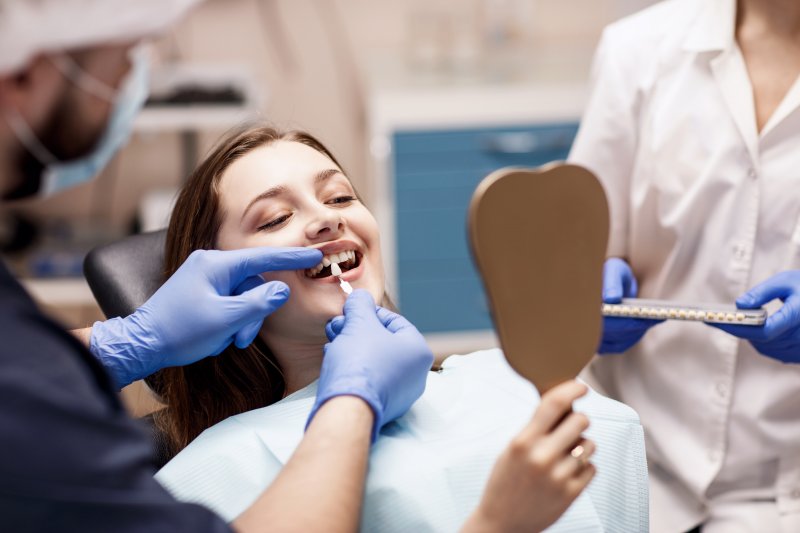 A woman receiving cosmetic dentistry